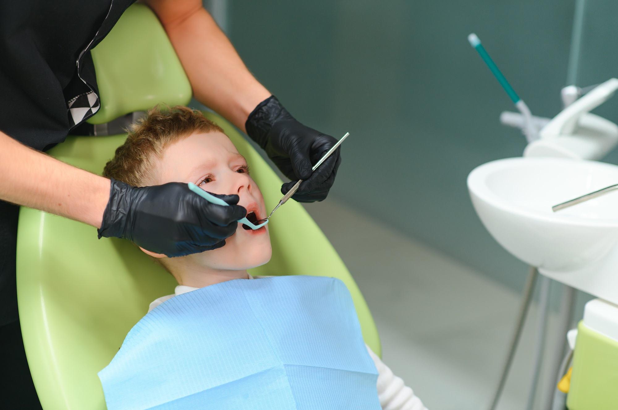 Crying and screaming little boy at the dentist